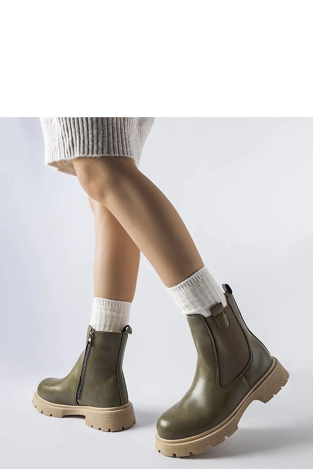 White ankle boots with a beige sole