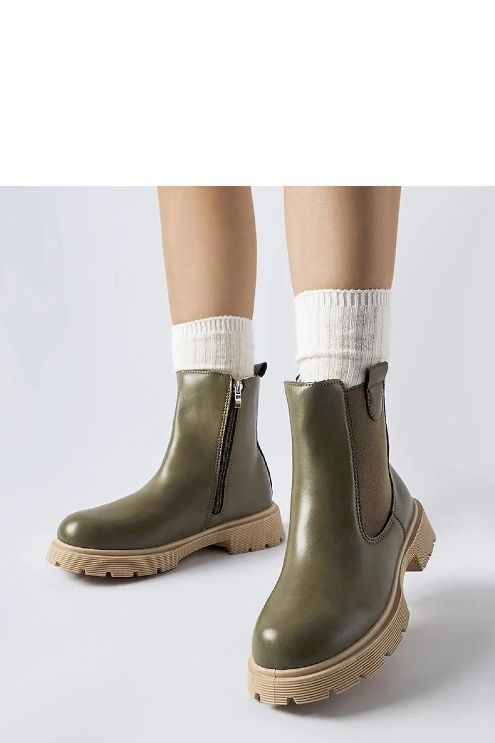 White ankle boots with a beige sole