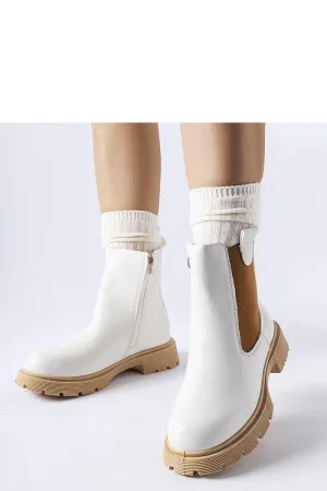 White ankle boots with a beige sole
