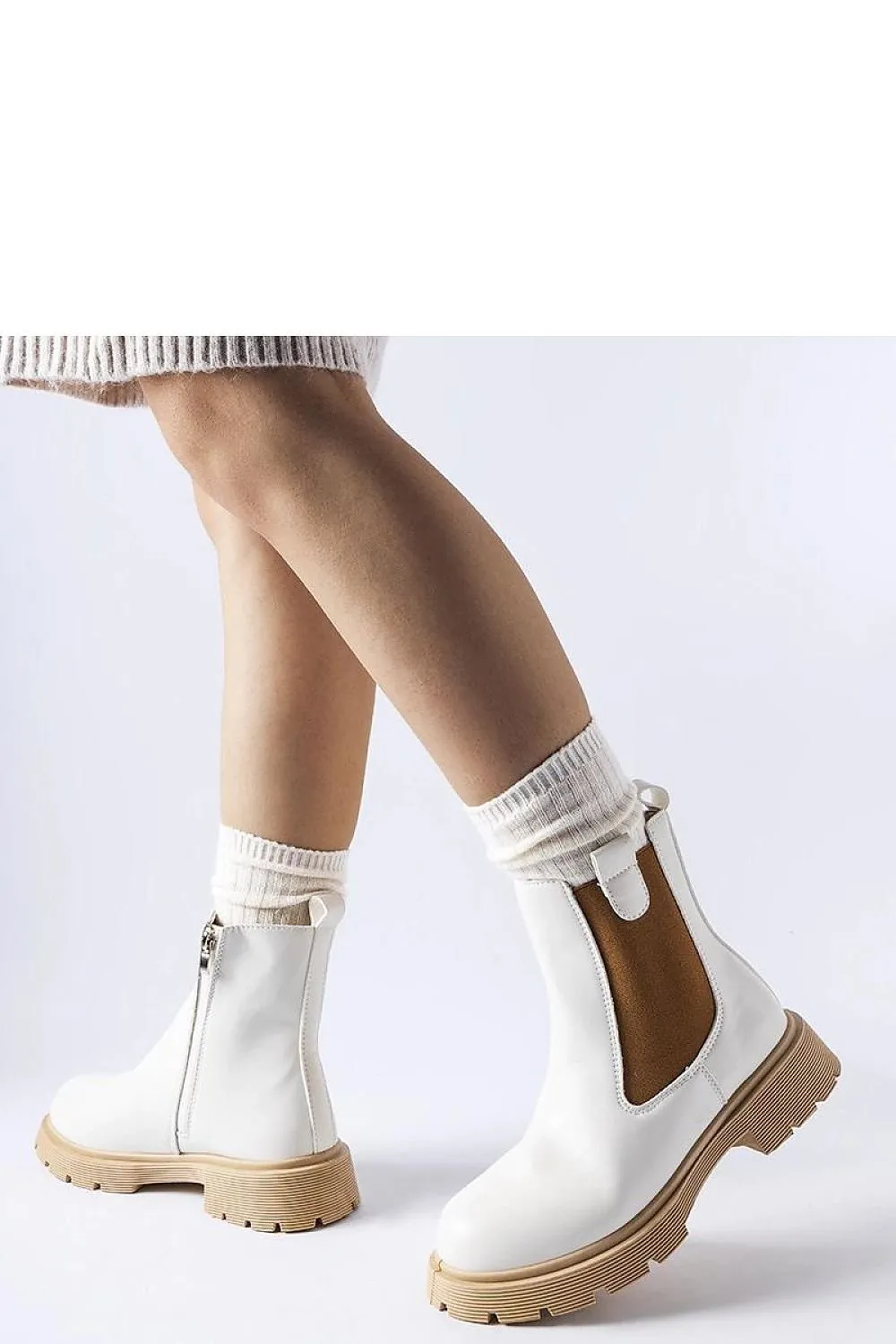 White ankle boots with a beige sole