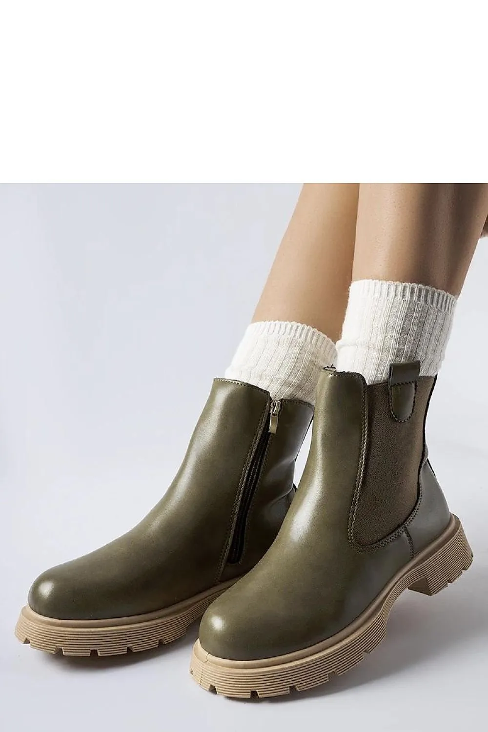 White ankle boots with a beige sole